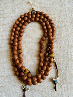 Wonderful used and very good quality Bodhi seeds prayer beads is from Namo Buddha, Nepal. This prayer beads has lots of blessings from many temples and lamas. Counted lots of mantras on this mala. Very nice and smooth. 27 inches long Bodhi mala is perfect for all mantras. With counter, agate Dzi guru beads and extra decoration beads makes Mala more beautiful. Spiritual Mala With 108 Beads For Blessing, Bohemian Mala With 108 Beads For Blessing, Bohemian 108 Beads Mala For Blessing, Hand-strung Spiritual Beads For Blessing, Brown Spiritual Beads For Meditation, Spiritual Wooden Beads Mala For Meditation, Handmade Spiritual Mala, Spiritual Wooden Beads Jewelry For Meditation, Adjustable Bohemian Mala For Blessings