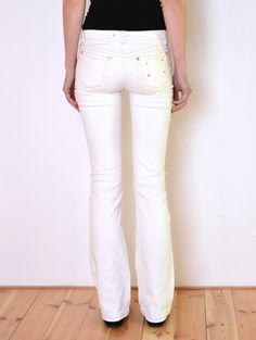 Cool vintage pants by Roberto Cavalli. Made of white denim fabric with a bit of stretch. The color is a warmer toneo f white, with lght beige stitches. Three pockets on the front, two on the back. Belt loops, zipper and a button closure. Signed, gold-toned button and rivets. Four snaps on the beck pocket. Pockets have a leopard print lining. Mid / low rise and flared legs. Era: early 2k, brand Roberto Cavalli. They have a hologram sewn along with tags. Fabric: 98% cotton, 2% elasthane Condition: White Stretch Flare Jeans With Five Pockets, White Flare Jeans With Five Pockets, Casual White Fitted Flare Jeans, White Fitted Flare Jeans Casual, White Fitted Flare Jeans Casual Style, White Stretch High Waist Flare Jeans, White Stretch Flare Jeans, Trendy White Stretch Flare Jeans, White Full-length Flare Jeans For Spring