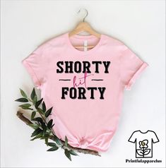 a pink shirt that says shorty forty on it