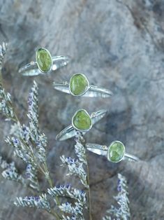 The rose cut peridot (August birthstone) shines alongside a tiny round green sapphire (September birthstone), both held securely in a bezel setting. Pair your peridot ring with peridot earrings to channel a free spirited and joyful vibe. Let this ring be the statement piece that adds a touch of whimsy and elegance to your style. Each piece of our jewelry is handcrafted with love. Peridot Earrings, Ring Birthstone, Gold And Silver Rings, August Birthstone, Ethical Jewelry, Peridot Ring, Green Peridot, Green Sapphire, Silver Engagement Rings