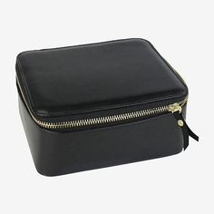 a black leather case with gold zippers