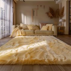 a living room filled with furniture and lots of windows