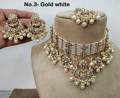 *Light Weight kundan choker necklace set. *Beautiful & Light in weight. *Necklace width: 2.2 inches (included drops) *Earrings length: 2.4 inches  (with drops)   *Earrings width- -1.4 inches White Round Necklace With Stone Work, White Temple Jewelry Choker For Festivals, Traditional White Round Choker, Heavy White Wedding Choker, White Kundan Choker Necklace In Temple Jewelry Style, White Kundan Jewelry Sets, White Kundan Necklace With Stone Work For Party, White Temple Jewelry Style Choker For Celebrations, White Temple Jewelry Choker For Celebrations