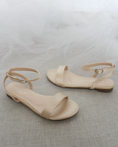 Classy satin flat sandals with ankle strap. Effortless yet adorable to wear on your favorite occasion. Can be pair with dress or casual look.DETAILS:COLORS AVAILABLE: Ivory, White, Pink, Light Blue, and ChampagneUPPER: Synthetic upper and liningMATERIALS: Mandmade outsoleSTYLE NAME: MADDY