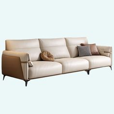 an image of a couch with pillows on it's back legs and armrests