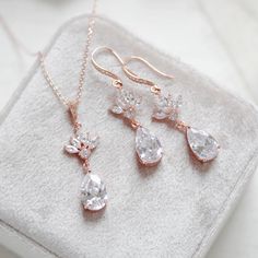 Beautiful Bridal jewelry set created using rose gold finish components set with Premium Cubic Zirconia stones for amazing sparkle. Personally designed and created by me.  - Earrings measure 2" x 1/2" - Necklace measures 16 inches and extends to 18 inches - Pendant measures 1.5" x 1/2" - Rose gold finish - Premium Cubic Zirconia stones - Premium European crystal pearls - Nickel free and hypoallergenic - Available in rose gold, yellow gold and rhodium finish. - Handcrafted in the US in my studio - Gold Jewelry Bridal, Gold Earrings Bridal, Bridal Backdrops, Bridesmaid Jewelry Set, Beautiful Bridal Jewelry, Jewelry Rose Gold, Gold Bridal Earrings, Necklace Rose Gold, Bridesmaid Jewelry Sets