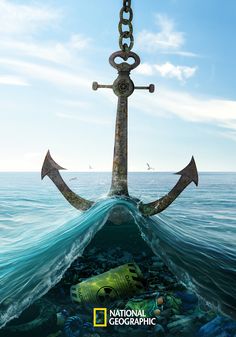 an anchor in the ocean surrounded by trash