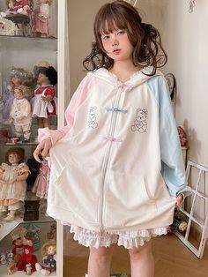 This jacket is crafted from pure cotton fabric, featuring an original design with unique prints and contrasting traditional Chinese frog button closures. Its loose fit is both flattering and stylish. The jacket also comes with convenient pockets on both sides, adding practicality to its charm. To top it off, the hood is adorned with soft and adorable bear ears, making it irresistibly cute when worn.  The price includes one jacket only.   	 		 			Size 			Free Size 		 		 			Bust 			140 		 		 			Le Harajuku Style Cotton Outerwear With Pockets, Harajuku Style Cotton Hoodie Outerwear, Kawaii Cotton Outerwear For Winter, Harajuku Style Winter Cotton Outerwear, Spring Cotton Kawaii Hoodie, Harajuku Cotton Long Sleeve Outerwear, Harajuku Style Cotton Outerwear With Drawstring Hood, Harajuku Style Long Sleeve Cotton Outerwear, White Harajuku Hooded Outerwear