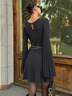 Ribbed Mini Dress For Night Out In Fall, Ribbed Mini Dress For Fall Night Out, Black Ribbed V-neck Mini Dress, Elegant Black Knitted Sweater Dress, Ribbed V-neck Sweater Dress For Night Out, V-neck Ribbed Sweater Dress For Night Out, Fitted Black Knitted Sweater Dress, Ribbed Knit Mini Dress For Night Out, Black Knitted Long Sleeve Sweater Dress