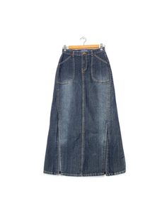 2000s Blue jeans maxi denim skirt, 2 front bottom slit Y2K 2000S Elegant and feminine vintage skirt. You can wear it in so many different stylings with t-shirt, crop top, silk top or a cardigan will fit into the season's layering thanks to its minimal trapeze line. Brand: Yilishi Tag Size: M fit like: S/M circa: 1990s-2000s color: blue fabric: denim condition: great vintage condition measurement +/- waist: 32 cm hips: 42.5cm back length: 92cm slit: 35.5cm Follow us on Instagram for the latest  @ Maxi Skirt Jeans, Maxi Denim Skirt, Skirt Jeans, T Shirt Crop Top, Denim Maxi Skirt, Front Bottoms, Denim Outfit, Y2k 2000s, Silk Top