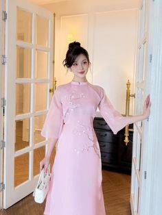 At EmTam Boutique, you will find the most stylish outfits in a wide size range and high quality at reasonable prices   - This set includes 1 ao dai top & pants, perfect for any special occasions like lunar New year, mid-autumn festival, wedding, temple, church or photoshoot...  - There might be up to 10% color variance due to lightning and viewing devices   - Sizes may run small so please go up 1 size or contact us if there's   any question. Please refer to the sizing charts for sizing.  - We su Spring Formal Cheongsam With Stand Collar, Elegant Ao Dai With Stand Collar For Spring, Pink Short Sleeve Cheongsam For Spring, Elegant Spring Ao Dai With Stand Collar, Elegant Pink Short Sleeve Sets, Traditional Pink Cheongsam For Wedding, Pink Stand Collar Dresses For Spring, Pink Stand Collar Dress For Spring, Spring Evening Ao Dai With Long Sleeves