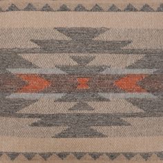 an old navajo rug with red and gray designs