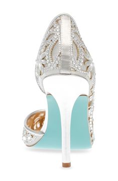 Sparkling crystals create an ornate pattern on a half d'Orsay pump that completes your look with undeniable glamour. 4" heel Textile upper/synthetic lining and sole Imported Crystal High Heel Shoes For Formal Occasions, Crystal High Heels For Evening, Crystal High Heels For Formal Occasions, Crystal Closed Toe Heels For Evening, Crystal Closed Toe Evening Heels, Glamorous Wedding Shoes With 4-inch Heel For Gala, Silver Crystal High Heels, Crystal Pointed Toe Heels For Evening, Crystal Pointed Toe Evening Heels