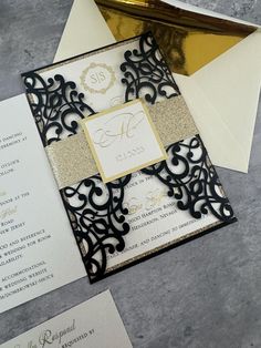 an elegant black and gold wedding suite with matching envelope, rsp card and letter