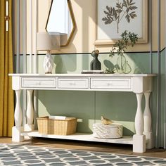 a white console table with two drawers and a basket on the bottom shelf next to it