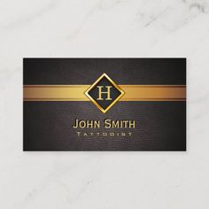 a black and gold business card with the letter h on it's front side