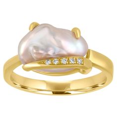 The ring is 18K Yellow Gold There are 0.04 Carats in Diamonds G VS The baroque pearl is 12.73mm x 8.00mm Freshwater Cultured The ring is a size 7, sizable The ring weighs 5.3 grams Pearl Gold Ring, Pearl Diamond Ring, Cultured Pearl Ring, Pocket Watch Antique, Pearl And Diamond Ring, 18k Gold Ring, Diamond Star, Star Jewelry, Freshwater Cultured Pearls