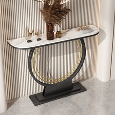 a white marble and black metal console table with gold accents on the top, in front of a striped wall