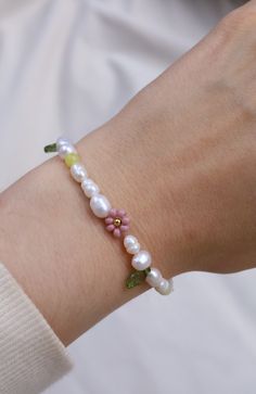 Pearl bracelet is handmade from the best materials. You can buy a sunflower bracelet as a gift for a friend, sister, or mother. MATERIALS of daisy flower bracelet: Pearls, pink pearl, seed beads, rose quartz heart and an extender chain (not in the picture). ALSO AVAILABLE AS A NECKLACE. SO YOU CAN A BUY A JEWELRY SET. https://www.etsy.com/listing/1276098651/lavender-beaded-flower-necklace-pearl SIZE of delicate bracelet : The Length is adjustable. A chain is added to each bracelet for additional Dainty Handmade Pearl Bracelet, Daisy Flower Charm Bracelets As Gift, Delicate Flower Charm Bracelet For Spring, Handmade Flower-shaped Pearl Bracelet As A Gift, Daisy Flower Charm Bracelet For Gift, Handmade Flower-shaped Pearl Bracelet Gift, Handmade Dainty Pearl Beaded Bracelets, Handmade Daisy-shaped Bracelets For Gifts, Dainty Handmade Pearl Beaded Bracelets