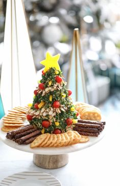 a christmas tree made out of crackers and pretzels on a platter