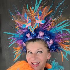 Beautiful Phoenix Fire Mardi Gras headdress could be a great addition to your fun party outfit... Decorated with sparkly blue, orange twigs, sparkly blue balls, pink hearts, colorful mesh, tulle, sequin, ..in the middle two Azure blue, Pink, Gold embroidered Phoenix birds. Blue back side.  Light weight, elastic in the back, fits most heads. Colors might look sliightly different from pictures due to your screen setting. All crowns hand made. Shipped by USPS next business day! NO refunds, NO returns, but please let me know if something wrong with your item.  Check my shop for other Holiday crowns and matching face mask. Contact me for special orders. Thank you for your interest in my design. Have fun, stay safe. Fantasy Festival Headpiece With High Crown, Adjustable Structured Crown For Festival, Adjustable Structured Crown For Festivals, Round Crown Costume Hats For Carnival, Carnival Costume Hat With Round Crown, Whimsical Crown Costume Hat For Carnival, Whimsical Crown Headpiece For Mardi Gras, Carnival Festival Crown Headband, Whimsical Crown Costume Hats And Headpieces For Parties