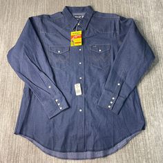 Vintage 80s Wrangler Two Pocket Pearl Snap Cowboy Western Dress Formal Blue Button Up Long Sleeve Shirt Double Extra Large Mens *Y12 Condition:  Excellent Used Condition  = No Flaws Measurements: Please see photos above for all measurements IF YOU BUY TWO OR MORE ITEMS USE THE CODE BUNDLE @ CHECK TO SAVE 20% WE SHIP WITHIN 24 HOURS AFTER PURCHASE! Please be aware that we do not offer free returns!! The Buyer is responsible for the cost of the return label.  Follow us on TikTok & Instagram @findsnostalgic and tag us in your finds Blue Western Shirt With Button Closure, Blue Shirt With Pockets For Rodeo, Western Dress, Button Up Long Sleeve, Cowboy Western, Dress Formal, Mens Oxfords, Western Dresses, Western Cowboy