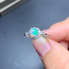 Ethiopian Opal Ring For Wedding, Multi-stone Opal Promise Ring, Opal Birthstone Ring In White Gold, Opal Ring With Cubic Zirconia And Halo Setting, Silver Multi-stone Round Cut Opal Ring, Silver Opal Ring With Multi-stone Round Cut, Diamond White Round Opal Jewelry, Diamond White Opal Ring Fine Jewelry, Ethiopian Opal Gemstone Jewelry, Round Shape