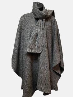 Heavyweight wool blend classic wrap with detached signature matching scarf. Dry clean Elegant Cashmere Winter Cape, Classic Wool Cape For Winter, Wool Poncho For Winter Workwear, Winter Wool Poncho For Work, Chic Wool Poncho For Winter, Classic Wool Cape For Fall, Classic Winter Cape For Work, Classic Winter Workwear Cape, Classic Cashmere Shawl For Winter