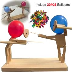 an image of two people playing with balls and arrows on a balance beam in front of a mirror