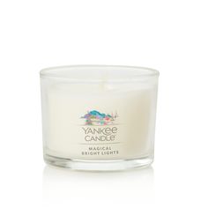 yankee candle in a glass container on a white background