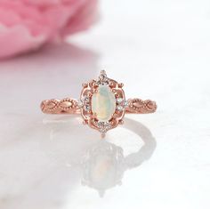 Natural Vintage Inspired Opal Ring ►Base Metal: Sterling Silver (925) ►Plating: 14K Rose Gold ►Accented With Simulated Diamonds (CZ) Gem size: 6.0 x 4.0 mm Carat Weight: 0.43 ct. Stone Creation: Natural Stone Origin: Brazil ► Solid rose gold ring can be purchased at: https://www.etsy.com/listing/694593215/vintage-natural-opal-ring-14k-solid-gold?ref=shop_home_active_1&frs=1 ►Sterling silver ring can be purchased at: https://www.etsy.com/listing/675970602/vintage-natural-opal-ring-sterling?re Classic Rose Gold Opal Ring For Anniversary, Heirloom Style Rose Gold Opal Ring For Anniversary, Vintage Rose Gold Rings With Birthstone, Heirloom Rose Gold Opal Ring Gift, Vintage Rose Gold Birthstone Ring, Rose Gold Opal Ring With Halo Setting For Anniversary, October Birthstone Jewelry, Natural Opal Ring, Rose Gold Accents