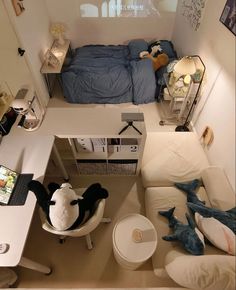 an aerial view of a bedroom with a bed and desk