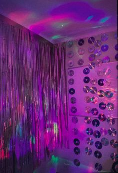 the room is decorated with disco balls and streamers