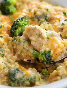 broccoli and chicken casserole in a white bowl with a serving spoon