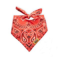 an orange bandana with red and black designs on it