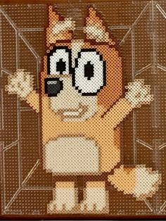 a cross - stitch picture of a cat with glasses on it's head and arms in the air