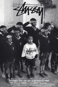 a group of young boys standing next to each other