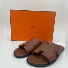 Bnib Full Inclusion. Hermes Mens Izmir Sandals. Hermes Mens Shoes, Mens Mules Shoes, Hermes Slippers For Men, Classic Beach Slides With Rubber Sole, Luxury Beach Slides With Rubber Sole, Luxury Summer Slides With Rubber Sole, Luxury Brown Slide Sandals, Luxury Slip-on Slides For Vacation, Luxury Brown Slides With Leather Sole