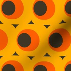 an orange and black pattern with circles on it's backgroung surface