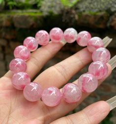 Material:pink rhodonite beads phantom quartz beads size :Approx 14mm   quantity: one strand  6mm approx 29 pcs one strands 7mm approx25 pcs one strands 8mm approx 22 pcs one strands 9mm approx 21pcs one strands 10mm approx 19 pcs one strands 11mm approx 18pcs one strands 12mm approx 16 pcs one strands 13mm approx 16 pcs one strands 14mm approx 15 pcs one strands 15mm approx 14pcs one strands 16mm approx 14 pcs one strands 17mm approx 13pcs one strands 18mm approx 13pcs one strands 19mm approx 12 Pink Rose Quartz Gemstone Beaded Bracelets, Pink Rose Quartz Gemstone Bracelets, Pink Crystal Bracelet With Natural Round Beads, Pink Crystal Bracelet With Natural Stones, Pink Crystal Gemstone Bracelet, Spiritual Pink Round Beads Bracelets, Pink Crystal Bracelet With Round Natural Stones, Pink Rose Quartz Round Beaded Bracelets, Pink Gemstone Crystal Bracelet