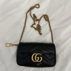 New Gucci Gg Marmont Super Mini Bag Black Can Be Worn As A Belt Bag Or Clipped On Another Bag. Brand New Never Worn Retails For $1,300 Plus Tax Gucci Black Bag With Gold-tone Hardware, Elegant Gucci Bag With Gold-tone Logo Plaque, Black Shoulder Bag With Gold-tone Logo For Everyday Use, Gucci Rectangular Bag With Gold-tone Logo Plaque, Gucci Rectangular Shoulder Bag With Gold-tone Logo, Gucci Gold Bag With Gold-tone Logo Plaque, Classic Gucci Bags With Gold-tone Logo Plaque, Luxury Gucci Bag With Gold-tone Logo Plaque, Gucci Travel Bag With Chain Strap