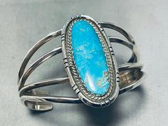 MAKE US AN OFFER BY CLICKING THE "MESSAGE SELLER" Button- Here we have a special vintage Navajo bracelet! It features a large Blue Gem turquoise stone surrounded by hand carved silver rope, and a quadruple rail silver cuff that graduates to a solid silver cuff! Impressive Artistry! Nestled in the rugged terrain of Nevada's vast desert landscape, the Blue Gem turquoise mine stands as a testament to both the enduring allure of natural beauty and the rich heritage of gemstone mining in the American Blue Oval Vintage Cuff Bracelet, Gemstone Mining, Navajo Bracelet, Desert Landscape, Vintage Navajo, Blue Gems, Sterling Silver Bracelet, Silver Cuff, Turquoise Sterling Silver