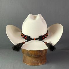 Beaded hat band with elastic stretch and horse hair tassels to fit an array of styles. Expected to fit hat sizes between 6 1/2" -8" Hair Tassels, Horse Hair Tassels, Beaded Hat Bands, Beaded Hat, Black And Orange, Horse Hair, Hat Band, Hat Sizes, Fitted Hats