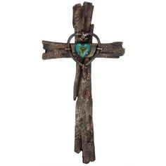 a wooden cross with a blue heart on it's center and two hands hanging from the side