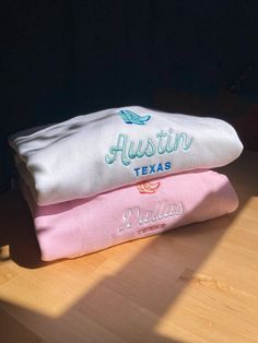 Dallas/Texas/Austin/Fort Worth Customizable Embroidered Crewneck  Embroidered on 50/50 cotton/polyester blend sweatshirts.  Need something custom? Need it by a certian date? We'd love to help! Please send us a message BEFORE placing your order. 📜 RETURN POLICY:WE DO NOT ACCEPT RETURNS OR EXCHANGES. Please consider this before purchasing. For more details, please read our shop policies.  👕 SIZING: *Sweaters are UNISEX fit. Sweatshirts fit true to size. Some garments are pre-shrunk but may shrin Pink Hoodie With Embroidered Text For Winter, Winter Pink Hoodie With Embroidered Text, Pink Embroidered Hoodie For Winter, White Cotton Sweatshirt With Custom Embroidery, Pink Embroidered College Sweatshirt, White Cotton Varsity Sweater, White Cotton College Sweater, Pink Embroidered Hoodie For Fall, Pink Crew Sweatshirt With Embroidered Graphics