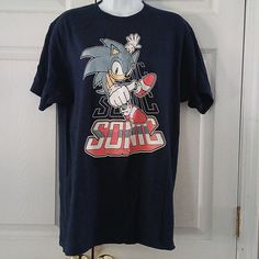 Sonic The Hedgehog Shirt Sleeve Navy Blue T Shirt Sz L Nwot Fabric 100% Cotton Measurements Lying Flat Are Chest Underarm To Underarm 21" Length 30" Each Digital Screen Displays Color Differently So Please Be Aware That The Actual Item May Appear To Be Slightly Different In Color Than What You See On Your Computer Or Phone Screen Located Bin 163 Fun Blue Crew Neck Shirt, Blue Graphic Print Shirt For Fans, Blue Short Sleeve Shirt For Fan Merchandise, Sonic Clothes Ideas, Sonic Clothes, Sonic T Shirt Design, Shadow The Hedgehog Shirt, Sonic The Hedgehog Shirt, Sonic Shirt