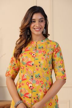 This mustard Floral Print A-line Kurta Set exhibits button down placket with coconut buttons details, sleeves has cuff and tab button along with Mandarin Collar & 3/4th Sleeves. Tailored from Cotton blend . Product Length: 45 Inches. Description  Size - Measuring Unit  : Regular Size                                 :  ( S, M, L, XL, XXL )  Ideal For                         :    Women Sales Package               :     1 Kurta::1 Palazzo Sleeve Length               :      3/4 Sleeve Pattern Yellow Summer Straight Kurta Set, Yellow Straight Kurta Sets For Summer, Yellow Summer Tops With Printed Motifs, Spring Yellow Tops With Printed Motifs, Mustard Color Straight Kurta Set, Mustard Straight Kurta Sets, Yellow Floral Print Sets For Navratri, Yellow Floral Print Sets For Diwali, Casual Yellow Kurta With Printed Motifs