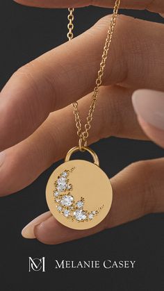 The Skyward Necklace was carefully handcrafted from solid 14k gold and depicts a crescent sweep made of ten round diamonds and three oval diamonds. ﻿The gold pendant is 19.5mm in diameter, 2mm thick and is available on its own or with a 20" rope chain that matches your choice of gold color: yellow, white, or rose. Find more images at melaniecasey.com. Elegant Crescent Rose Cut Diamond Jewelry, Fine Jewelry Diamond Moon Phase, Crescent Rose Cut Diamond Jewelry Gift, Crescent Shaped Rose Cut Diamond Jewelry Gift, Celestial Moon-shaped Jewelry With Rose Cut Diamonds, Fine Jewelry With Moon Charm For Wedding, Celestial Moon Shaped Jewelry With Rose Cut Diamonds, Yellow Gold Celestial Jewelry With Single Cut Diamonds, Crescent Yellow Gold Jewelry With Rose Cut Diamonds