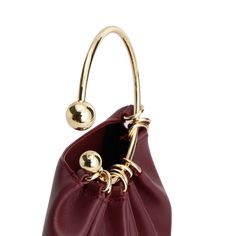 Details Charming and versatile, this Ring Handle Bag can be styled for your perfect evening dinner outfit! No matter the style of wear, the soft leather is a bronze example of quality. Size: Length: 21 cm Height: 17 cm Handle Diameter: 11.5cm Weight: 200g Shipping & Return Free US shipping on orders over $100.Free International shipping on orders over $300. For more details click HERE. Modern Gold Clutch With Detachable Handle, Modern Gold Clutch With Top Handle, Gold Leather Handheld Evening Bag, Modern Gold Clutch With Detachable Strap, Elegant Evening Bag With Round Handle, Chic Evening Bag With Round Handle, Elegant Burgundy Bags With Soft Leather, Gold Shoulder Bag With Metal Hardware And Round Handle, Gold Shoulder Bag With Round Handle And Metal Hardware