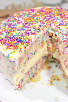 a white cake with sprinkles cut in half